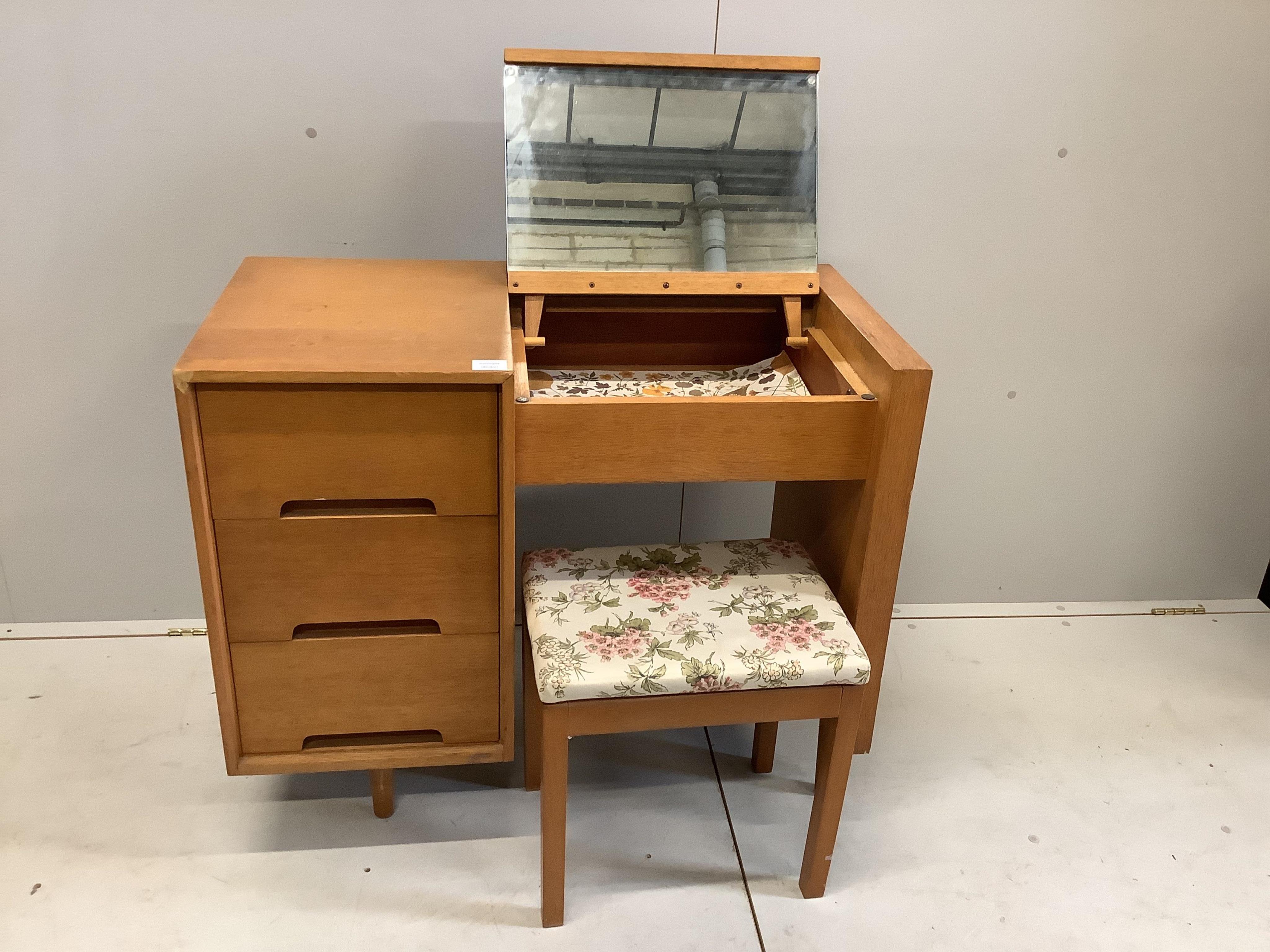 A mid century Stag C-Range oak and beech hinge top dressing table, width 88cm, depth 46cm, height 78cm, and a stool, and a mid century rectangular oak folding tea table, width 90cm, depth 52cm, height 77cm. Condition - f